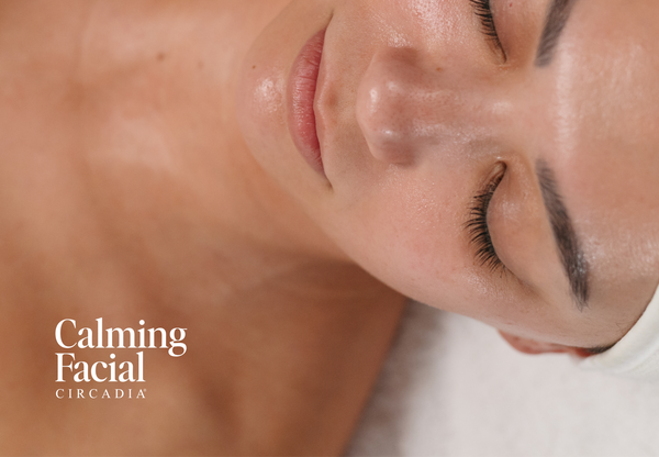 Woman receiving a facial with text 'A more visibly calm complexion is one facial away.' and 'Calming Facial Circadia' branding.